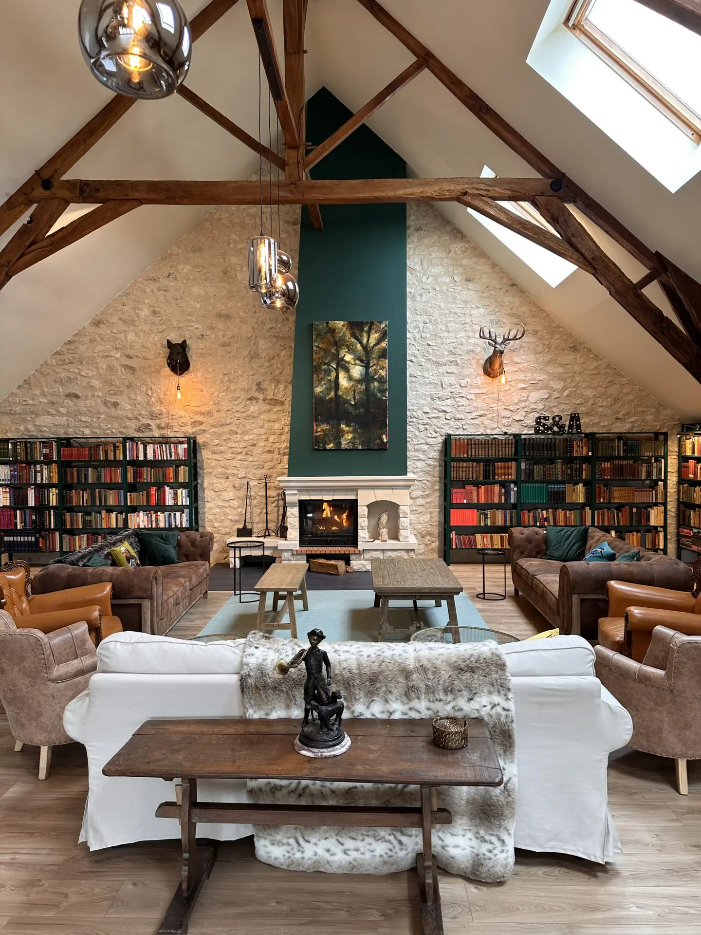 Forge in France Library with wood-burning stove at Domaine de Forge estate