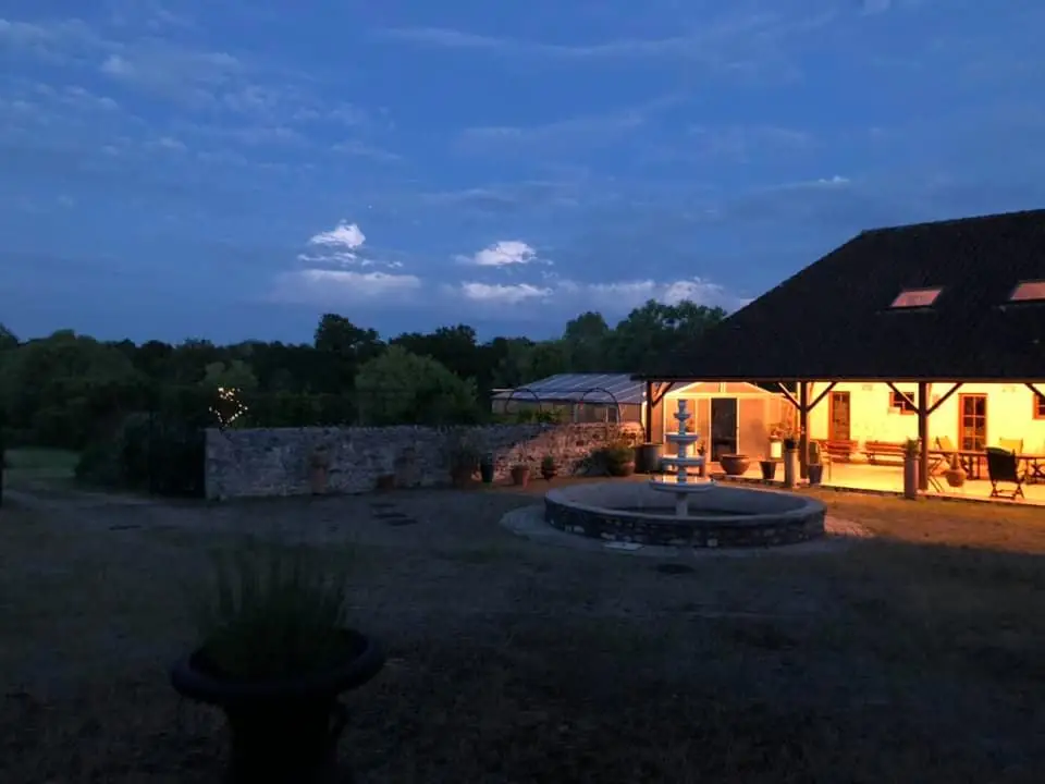 outside night fountain courtyard forgeinfrance